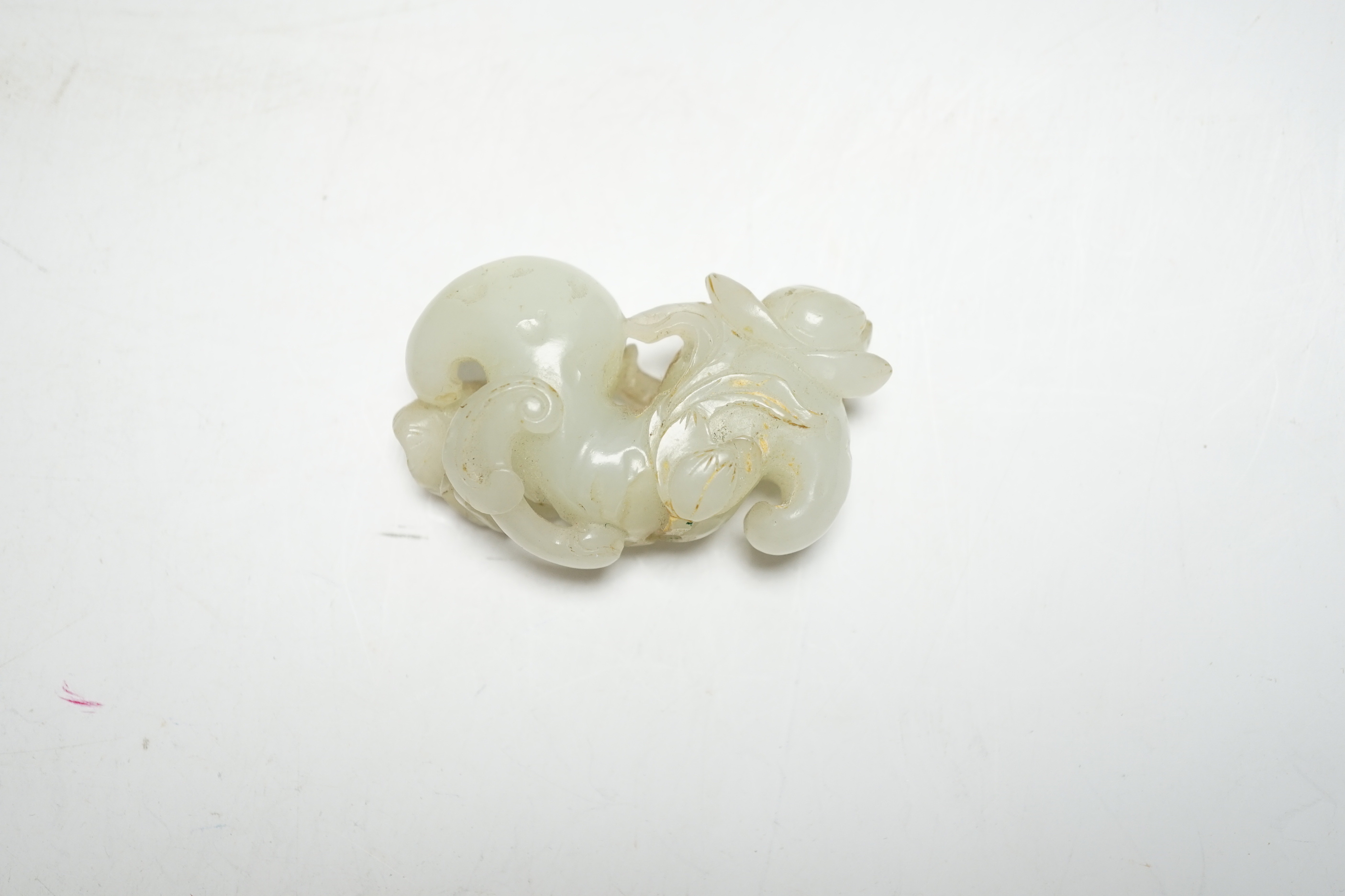 An 18th/19th century Chinese jade finial carving of a lotus node, flower and leaf, 6cm